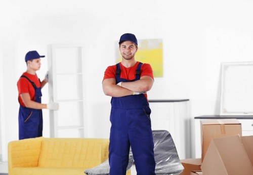 Local movers loading furniture into a Balham removal van