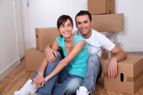 Packed boxes and furniture ready for a removal van in Balham