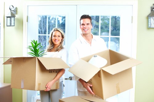 Careful loading of household items by a Balham removals crew