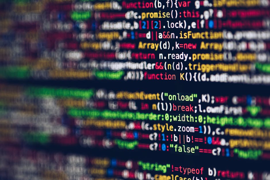 Photograph of a computer screen displaying lines of code in an editing software, with syntax highlighting in different colors such as orange, blue, green, and white, showing HTML elements and image so
